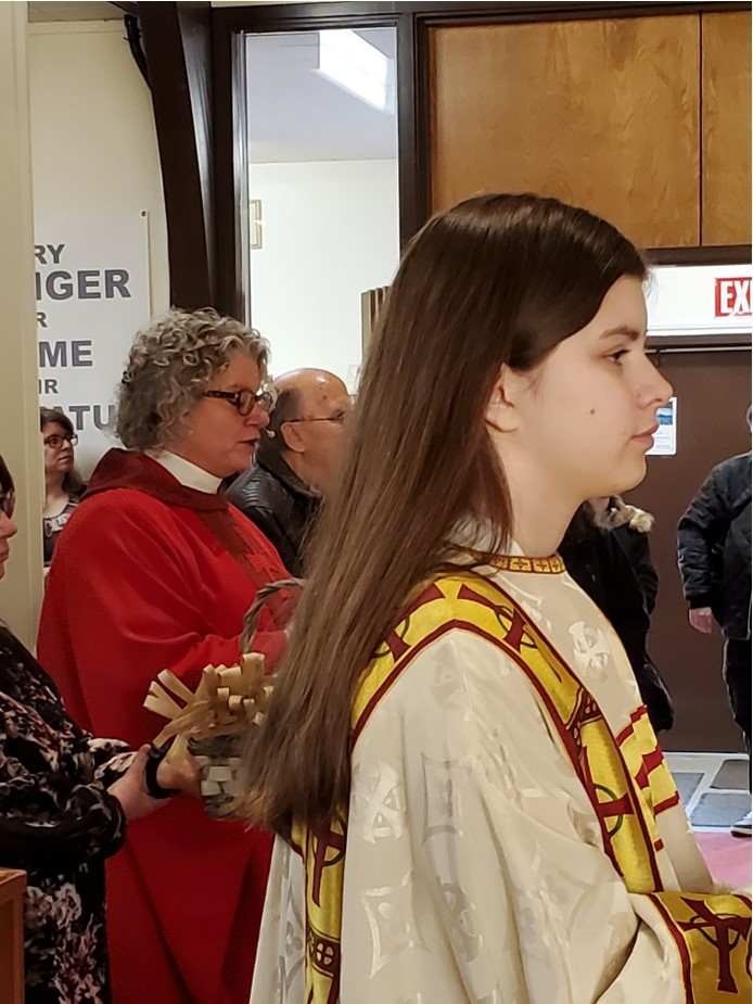 The Rev'd Cheryl Kukurudz (left) and Adriana Hoskin (right) wait for the service to begin at St. George's, Brandon on Palm Sunday. Photo Credit: the Rev'd Cheryl Kukurudz